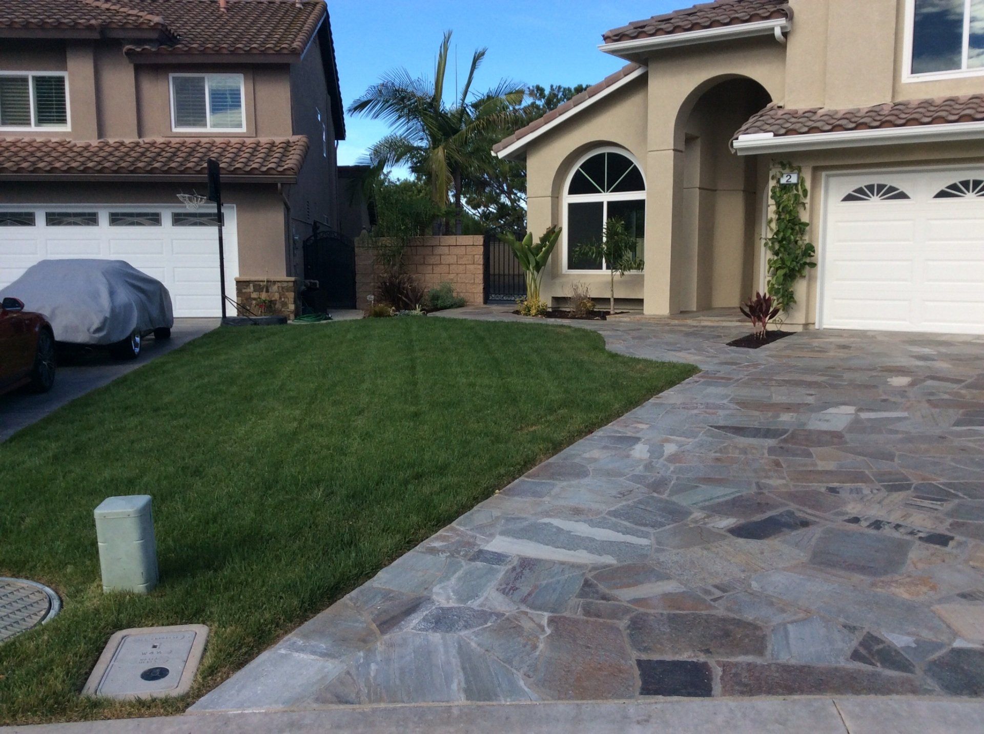 A house with a car parked in front of it