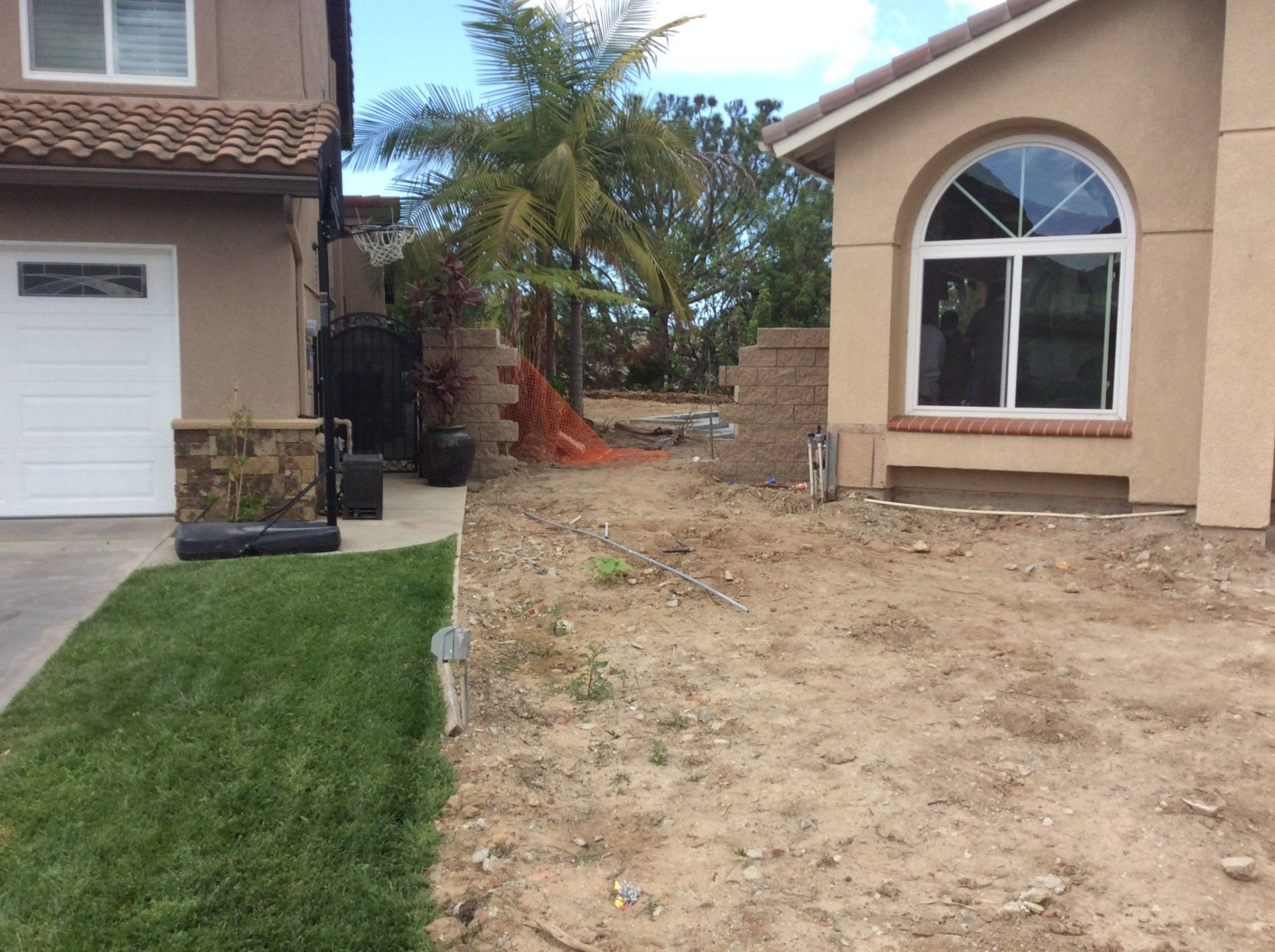 A house with a white garage door and a white window