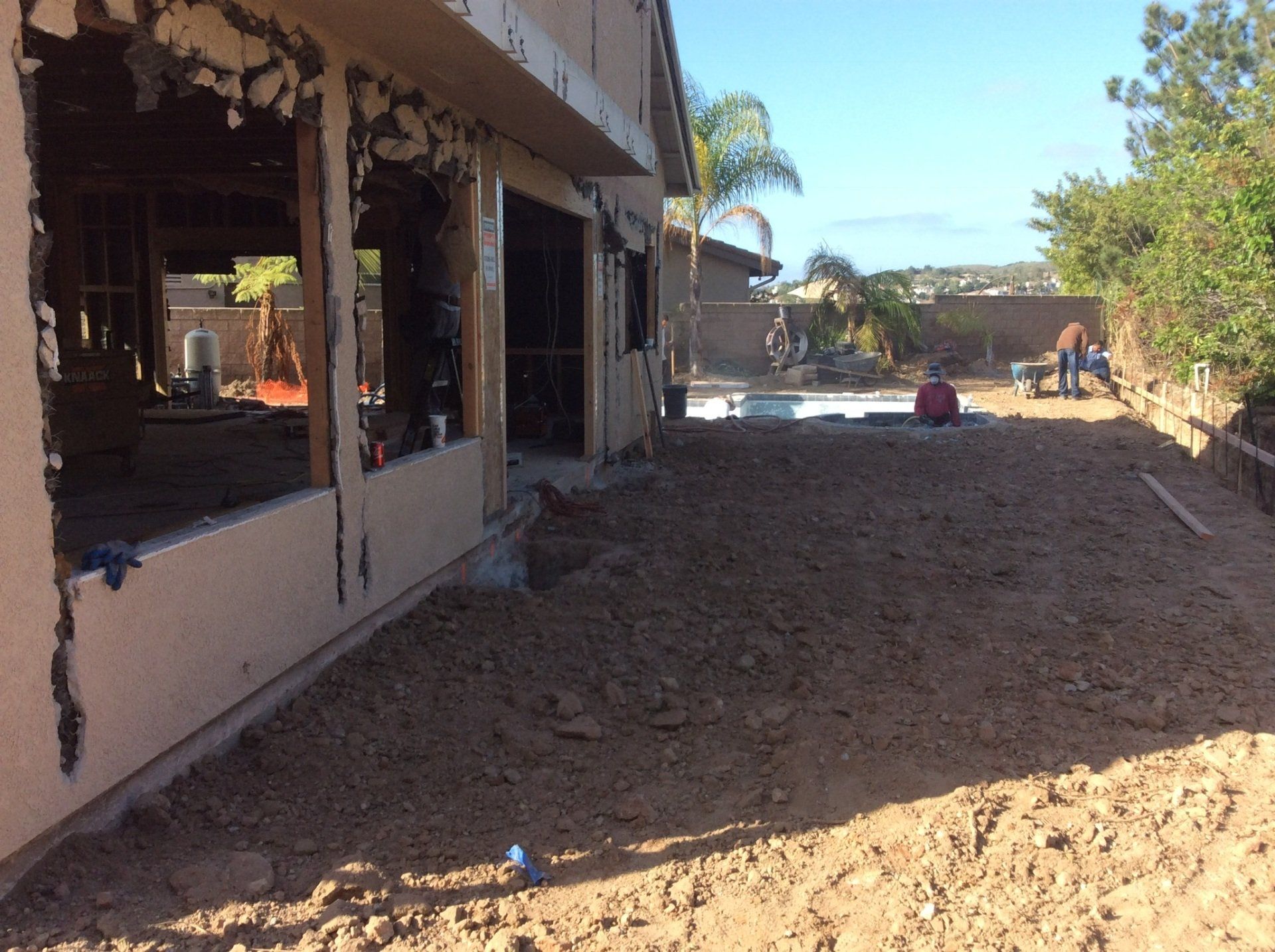 A house with a lot of dirt in front of it