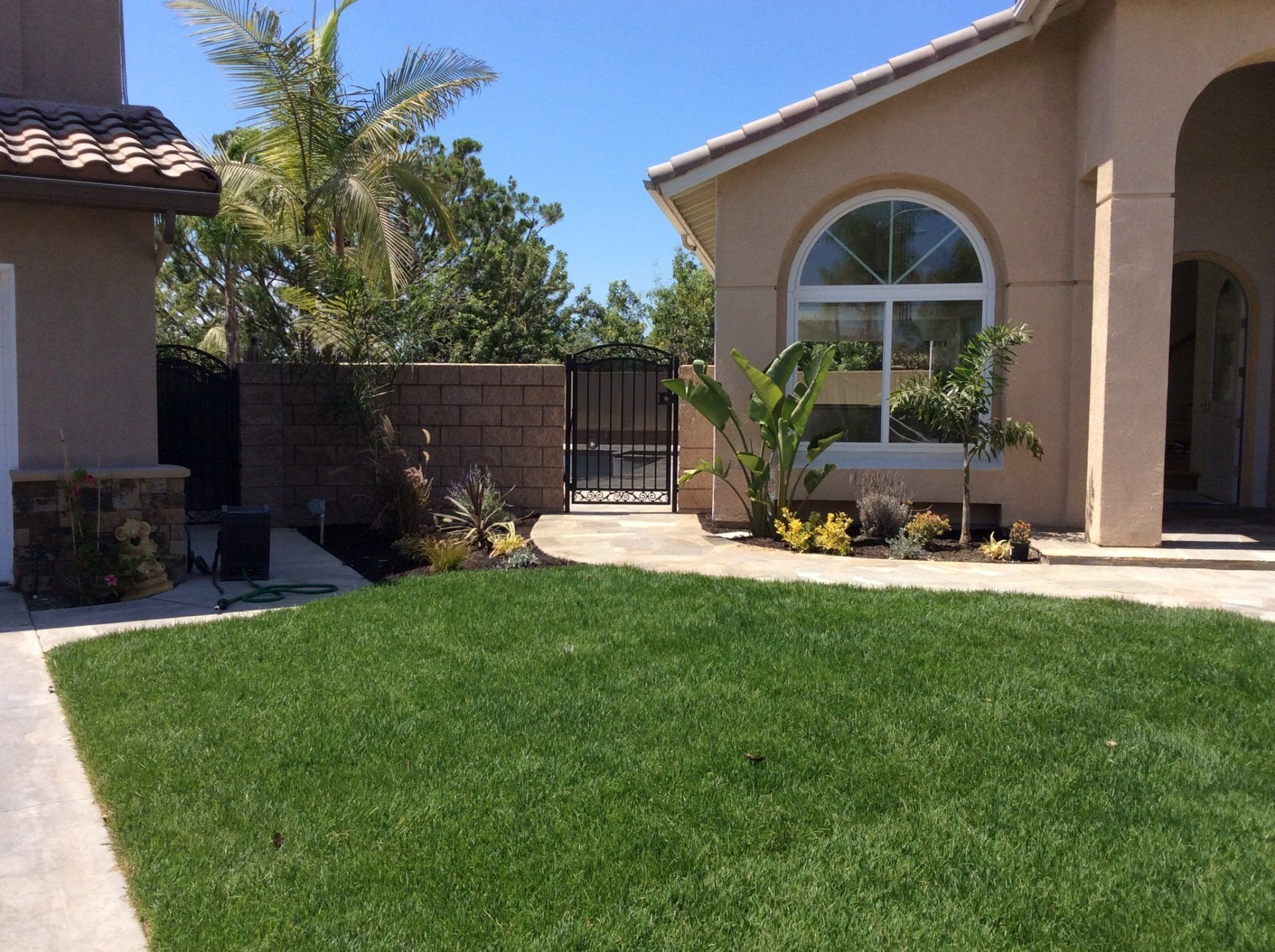 A house with a large lawn in front of it