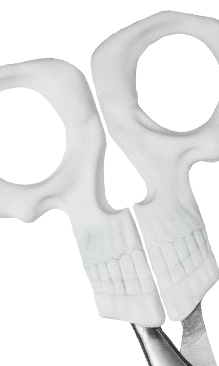 3D printer depositing pink material to create scissors shape on a black surface.