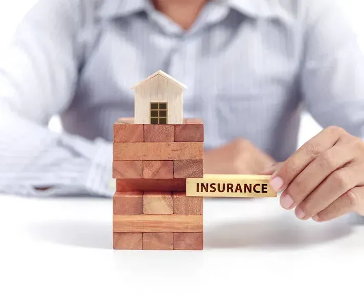 A person’s hand slides a wooden block labeled 