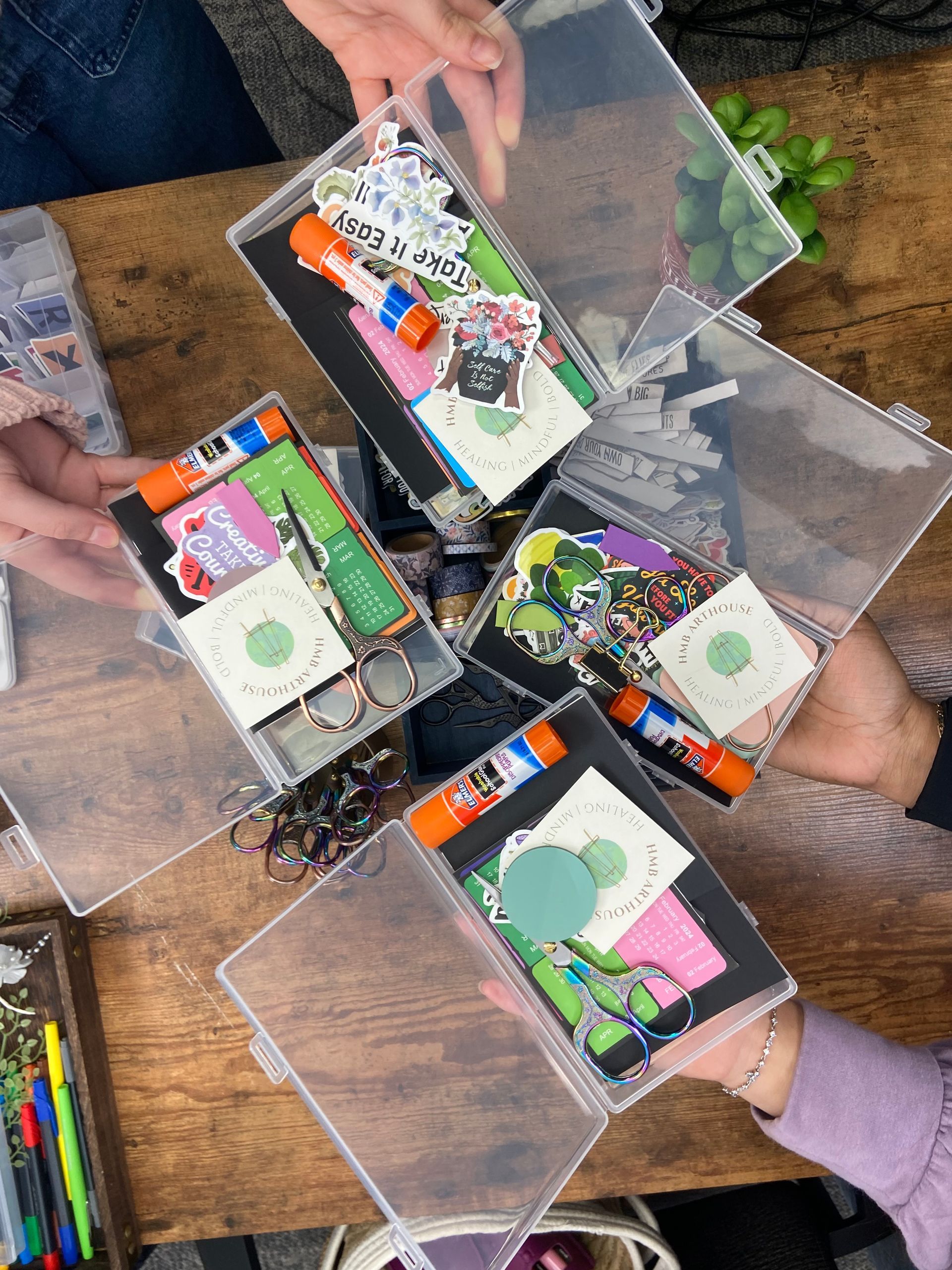 HMB Arthouse Vision Board Kit with scissors, glue, stickers, and various craft supplies.