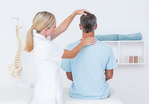 Doctor Doing Neck Adjustment — Pikeville, KY — Hackney & Hensley Chiropractic Center