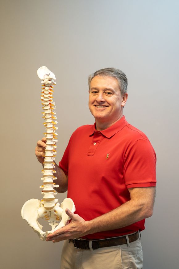 Physiotherapist Treatment on Man's Back — Pikeville, KY — Hackney & Hensley Chiropractic Center