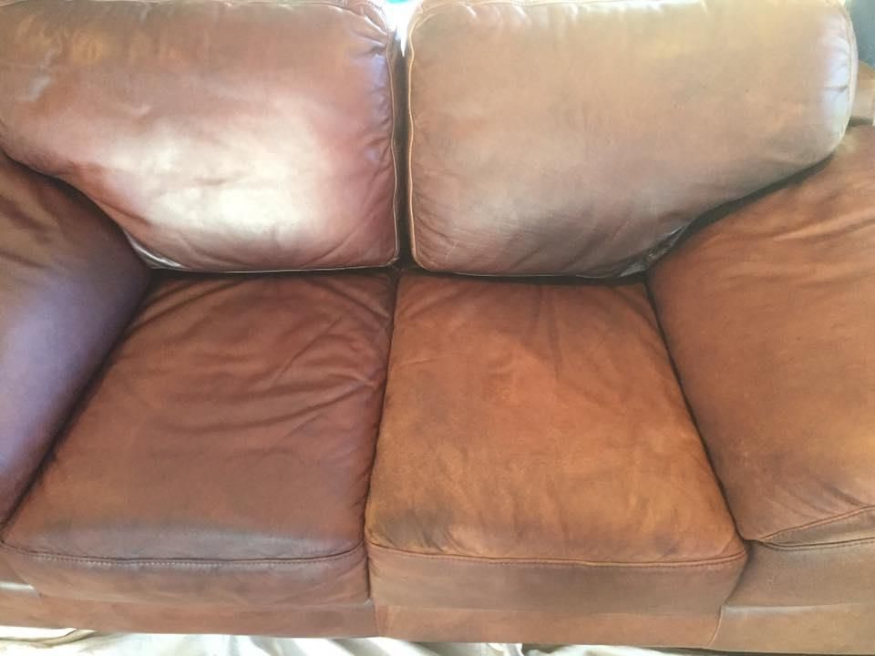 A Brown Leather Couch is Sitting on Top of a White Table — Abbsolve Services in Nambour, QLD