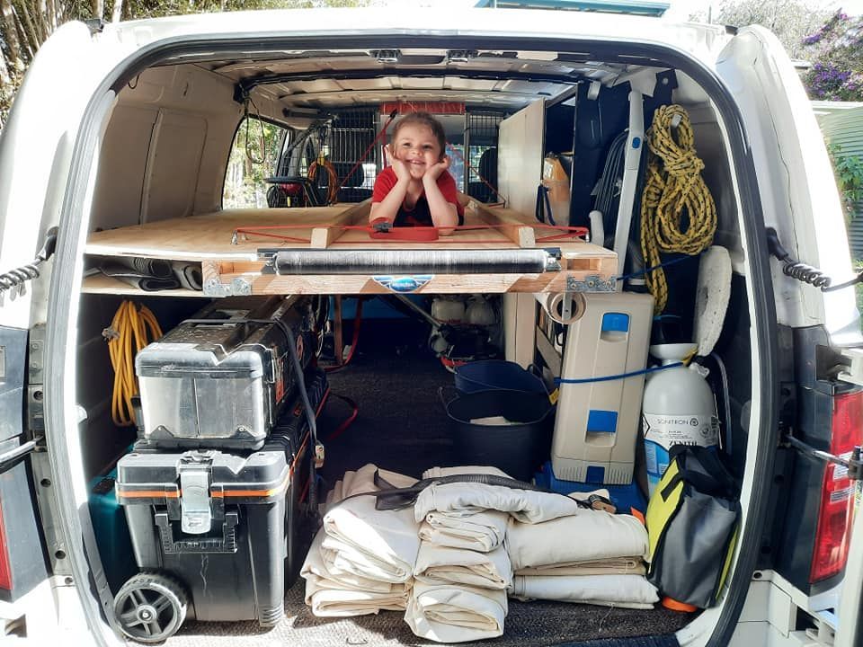 A Woman is Laying in the Back of a Van — Abbsolve Services in Cooroy, QLD