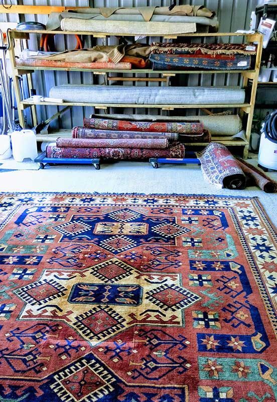 A Bunch of Rugs Are Stacked on Shelves in a Room — Abbsolve Services in Cooroy, QLD