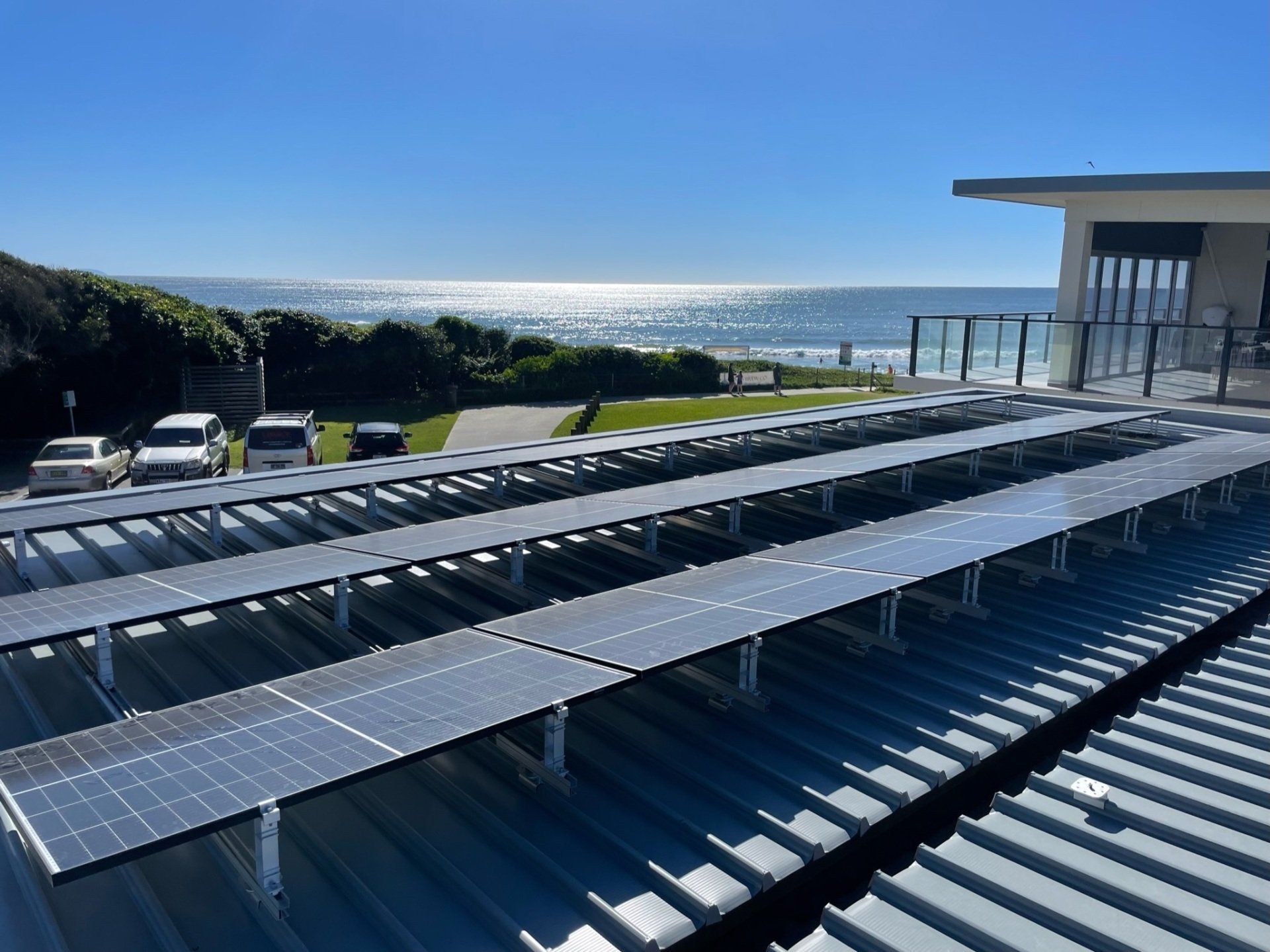 Technician on Roof Installing Solar Panels — Solar Electricians in Forster, NSW