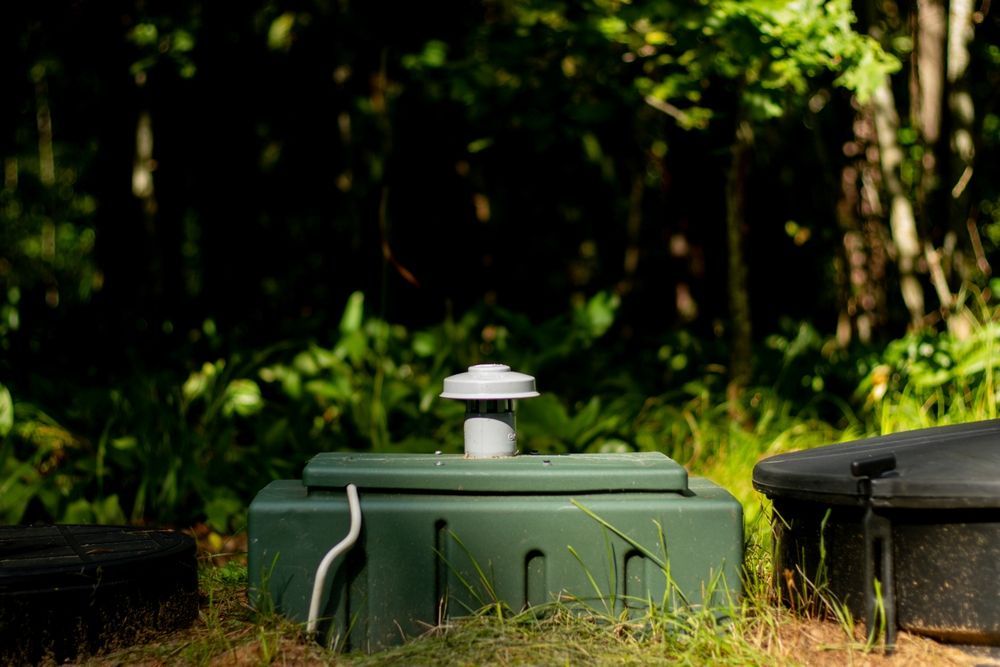 Gray electrical panel with open door, showing circuit breakers.