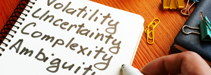 VUCA: Volatility, Uncertainty, Complexity, Ambiguity, written on a notebooks