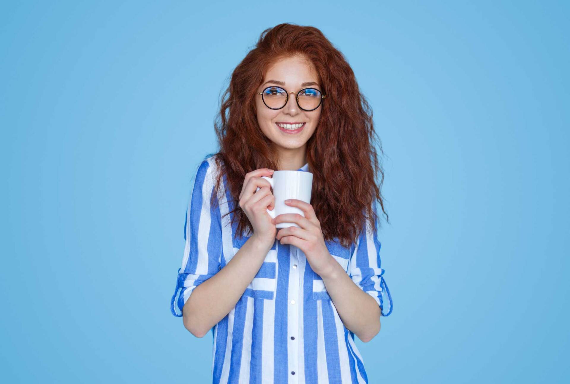 Red Head Girl Holding A Cup — Hendersonville, NC — Hendersonville Opticians