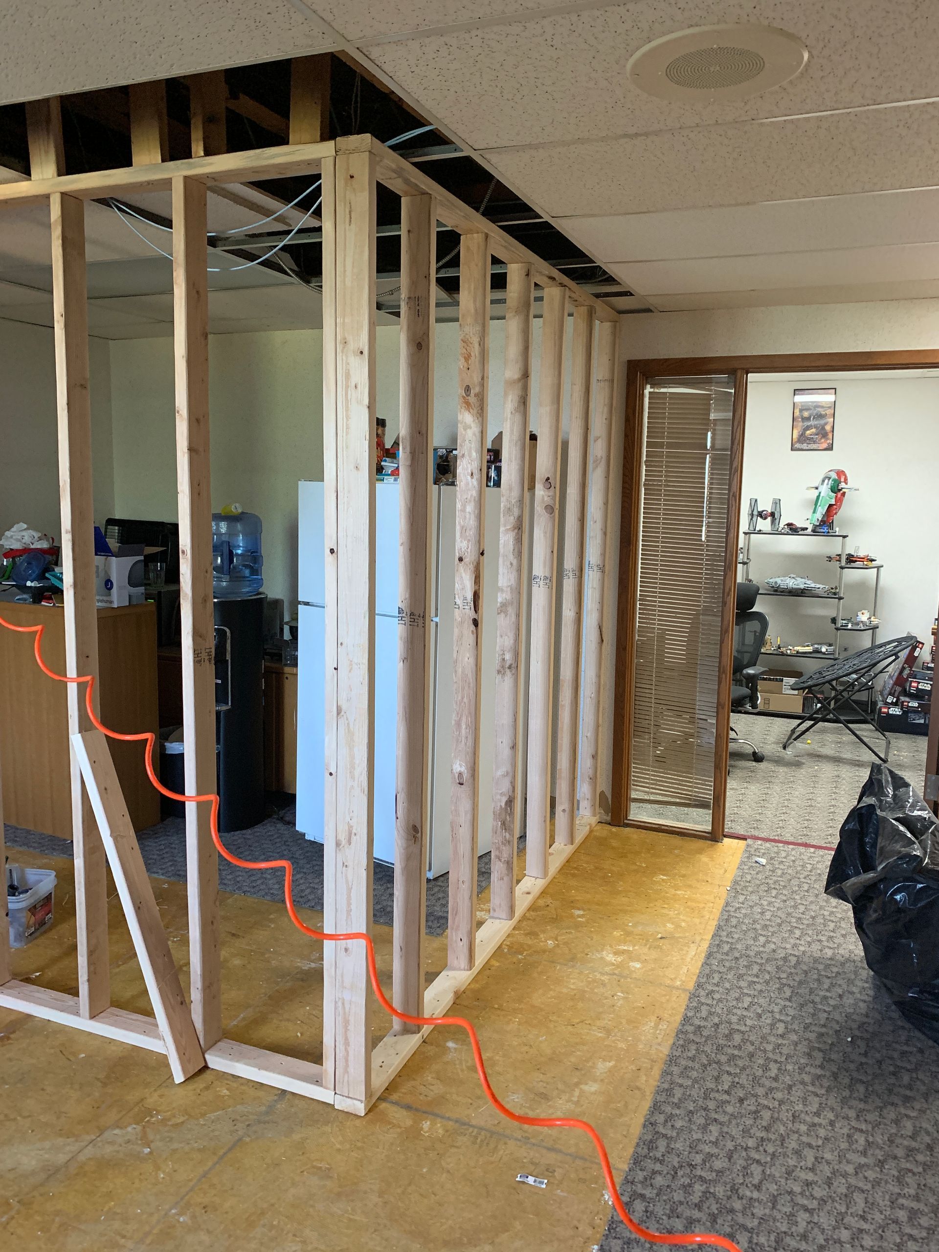 A room that is being remodeled with wooden walls