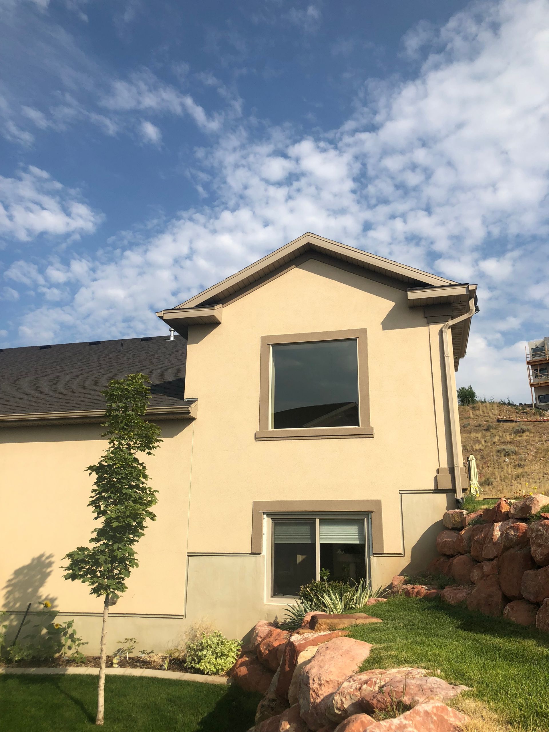 A house with a large window on the side of it