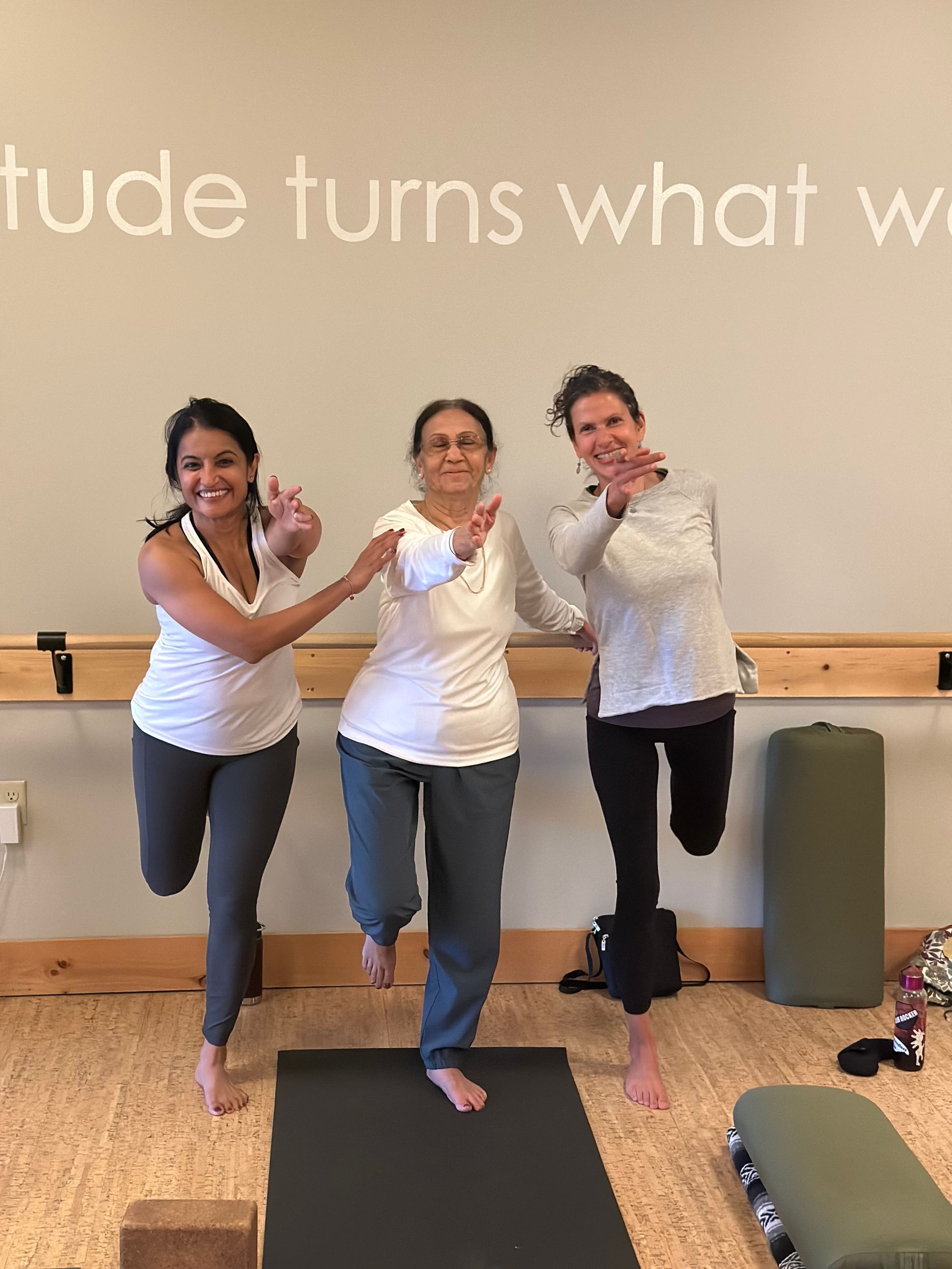 There women in yoga a pose in the yoga studio