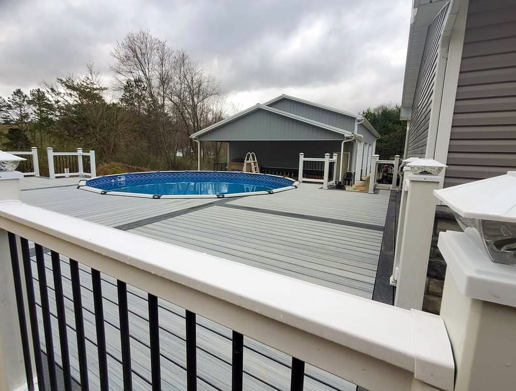 Light colored custom pool deck in Rochester NY that we installed for a customer