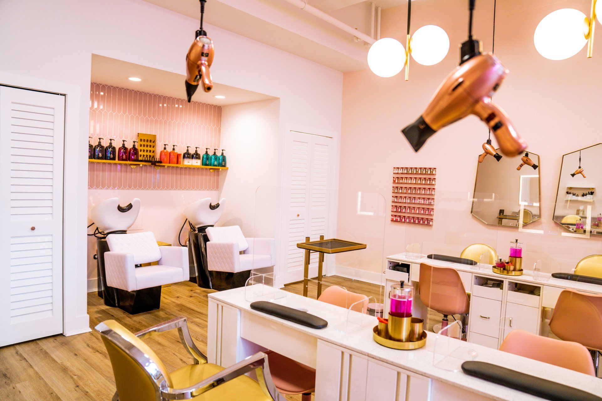 A hair salon with a hair dryer hanging from the ceiling.