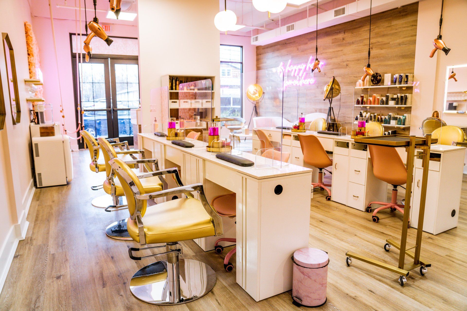 A salon with a lot of chairs and tables in it.