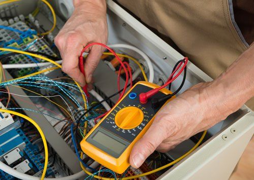 Electrician Checking A Fuse Box - Electric Contractors in Denville, NJ