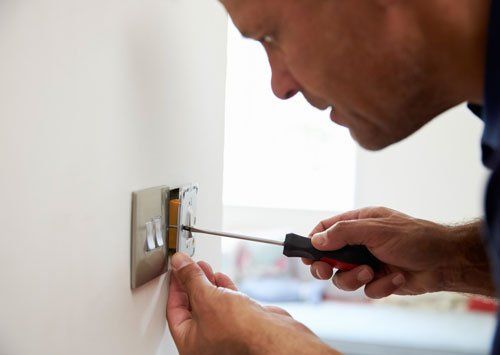 Electrician Repairing Domestic Light Switch - Electric Contractors in Denville, NJ