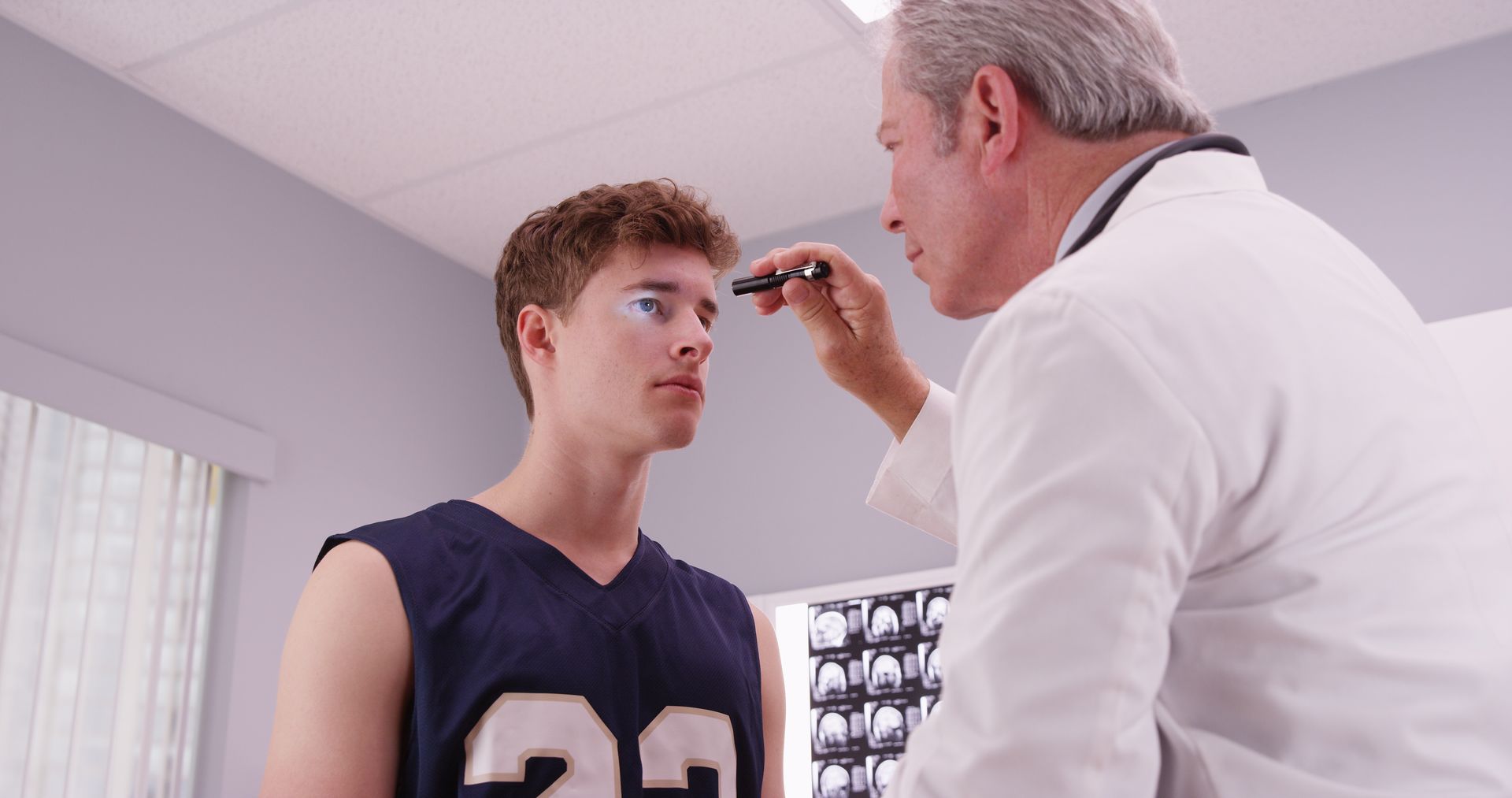 doctor checking an athlete's eye