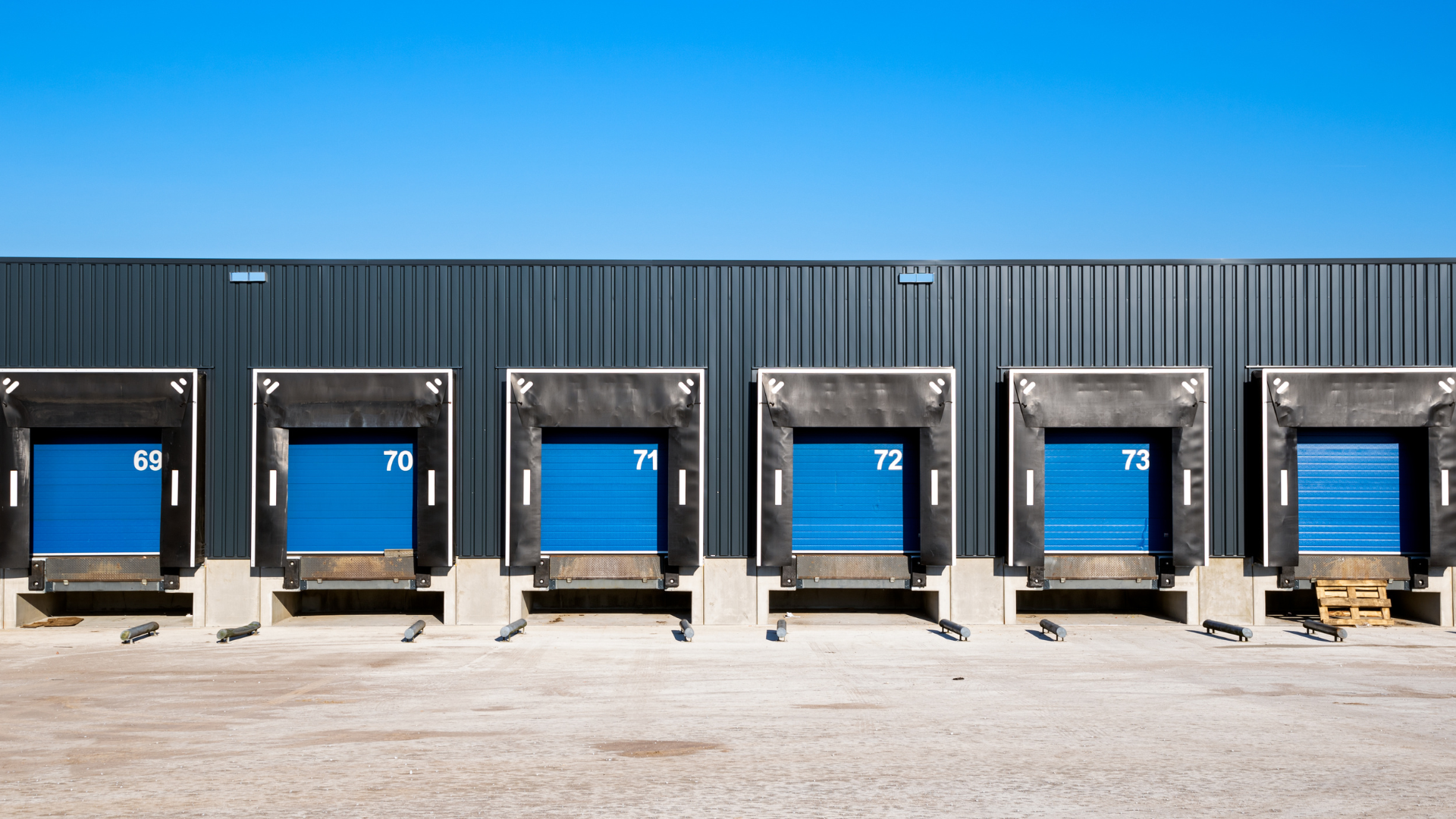 A white rv is parked in a grassy field.