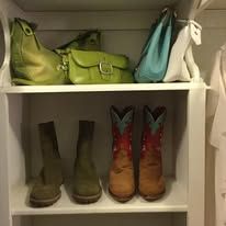 Shelf with purses and cowboy boots: green, turquoise, and tan.