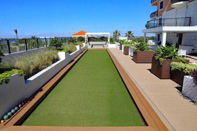 Synthetic turf in the backyard of a luxuious mansion. 