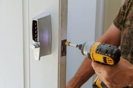 Expertly Installing a Lock With Precision Using a Drill Machine — Local Locksmith in Wonga Beach, QLD