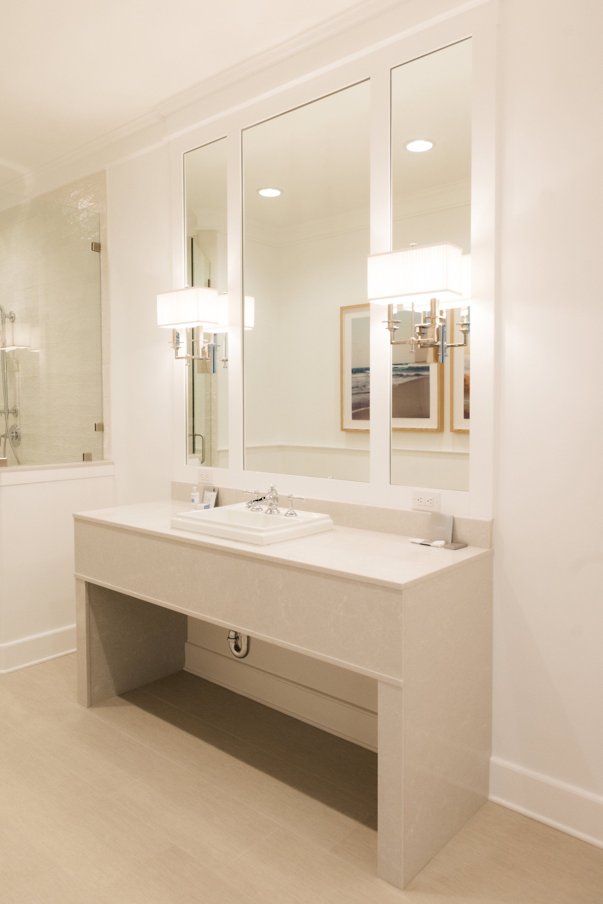 A bathroom with two sinks and two mirrors