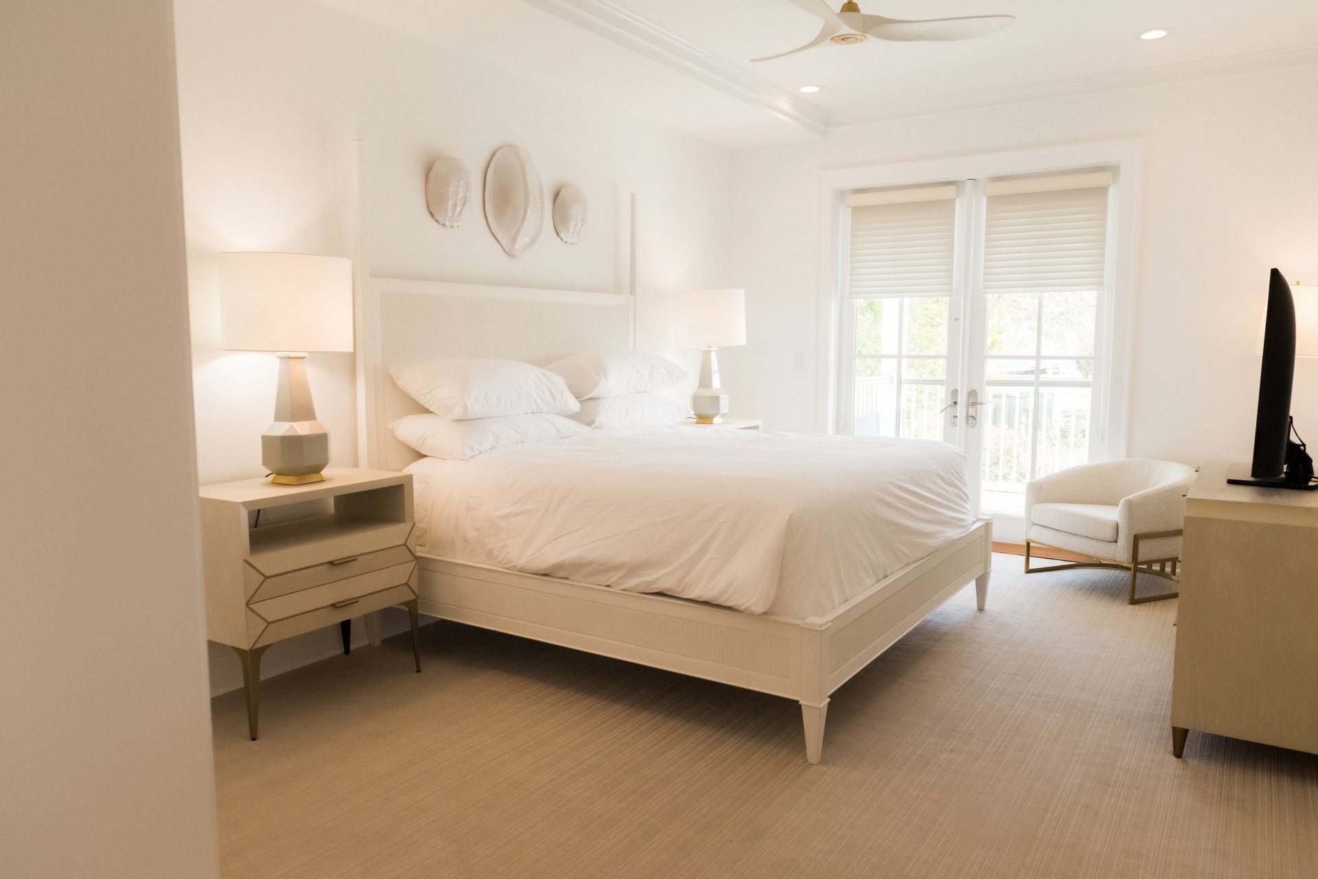 A bedroom with a large bed and a television