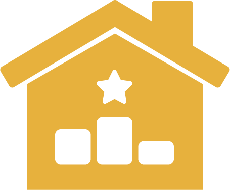 A yellow house with a star on top of it.