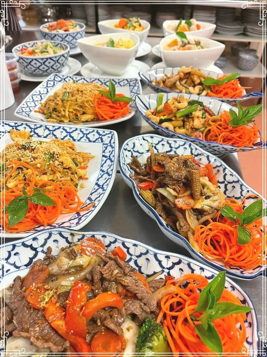Thai Dishes on Patterned Plates With Carrot Garnishes — Thai Taste Restaurant in Norman Gardens, QLD