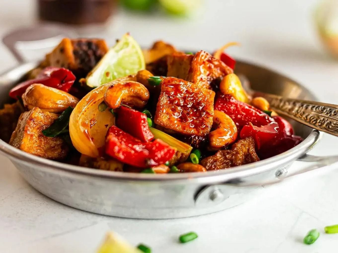 Tofu Stir-fry With Red Peppers, Cashews, and Lime in a Silver Bowl — Thai Taste Restaurant in Norman Gardens, QLD