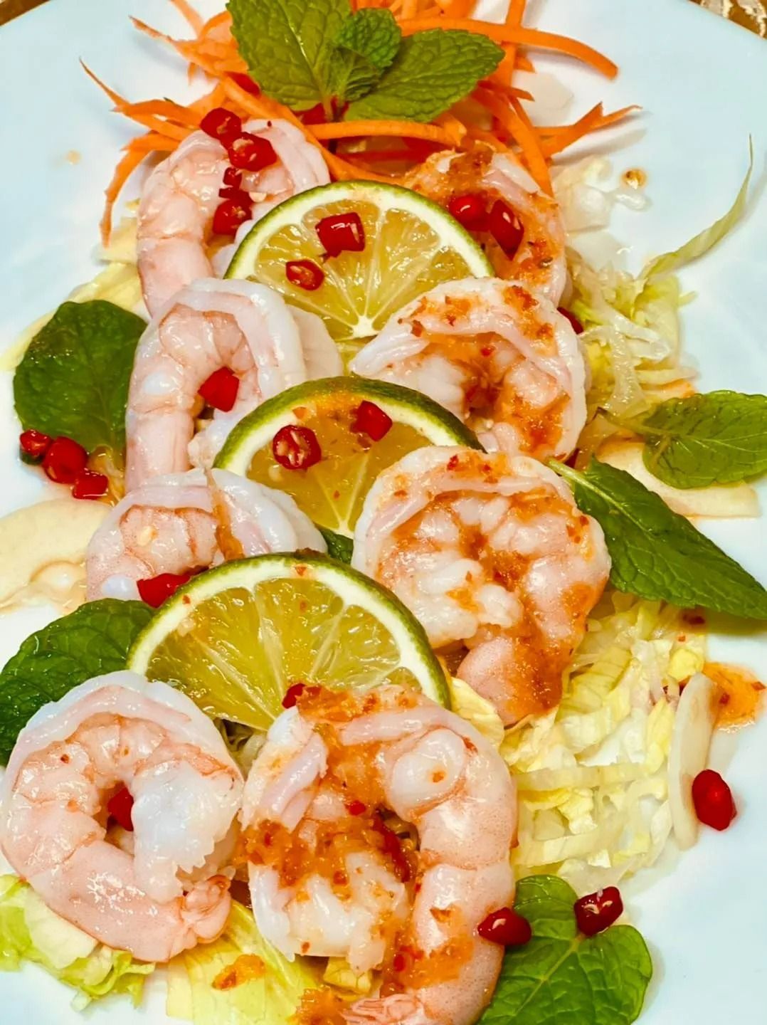Shrimp Salad With Lime Slices, Carrots, Mint, and Red Chili on a Bed of Greens — Thai Taste Restaurant in Norman Gardens, QLD