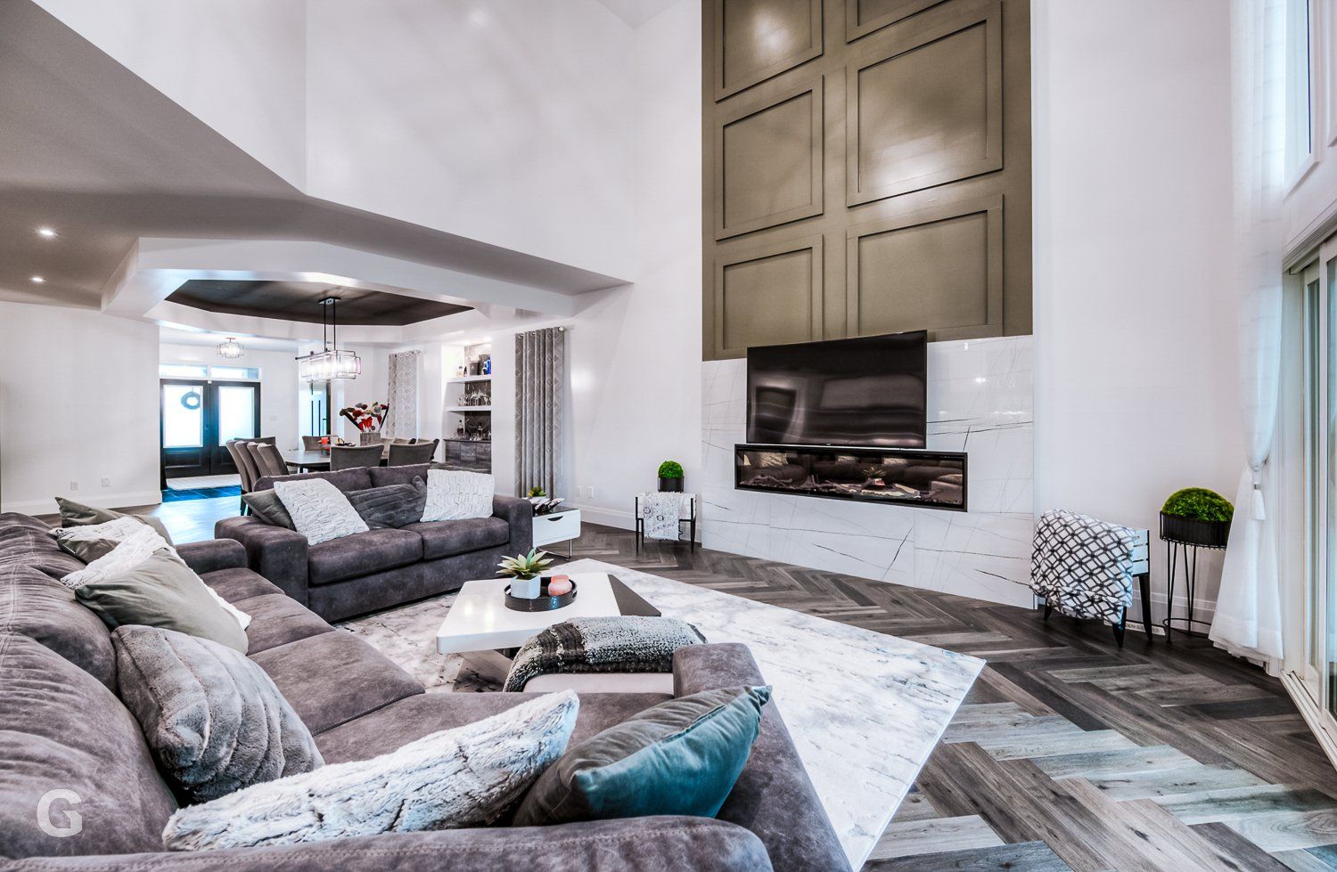 A living room filled with furniture and a flat screen tv.