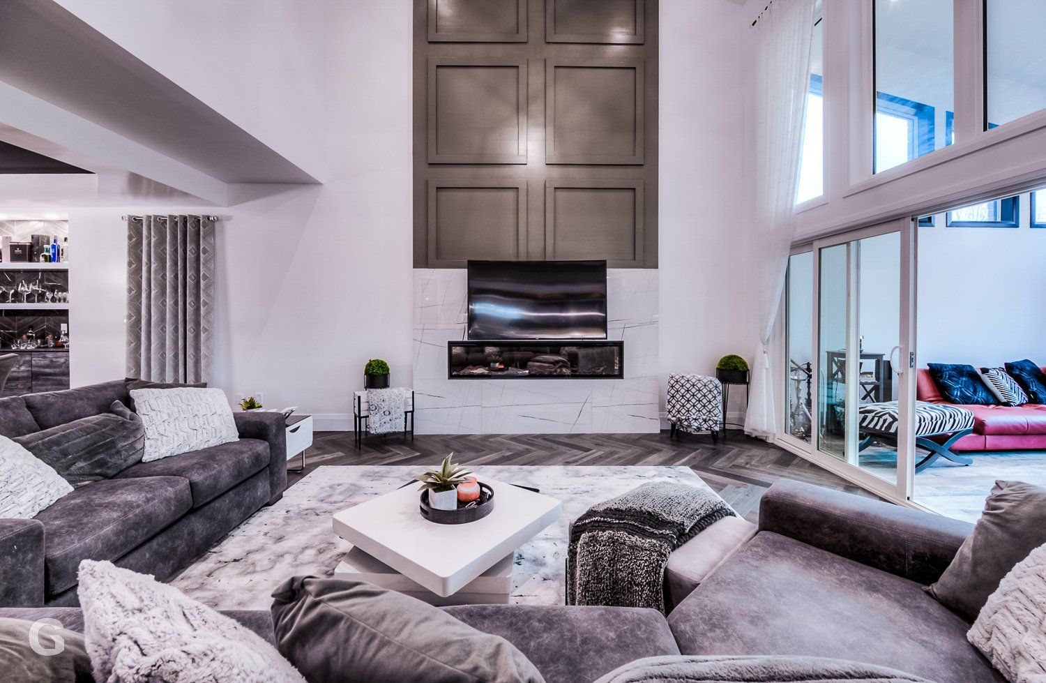 A living room filled with furniture and a fireplace.