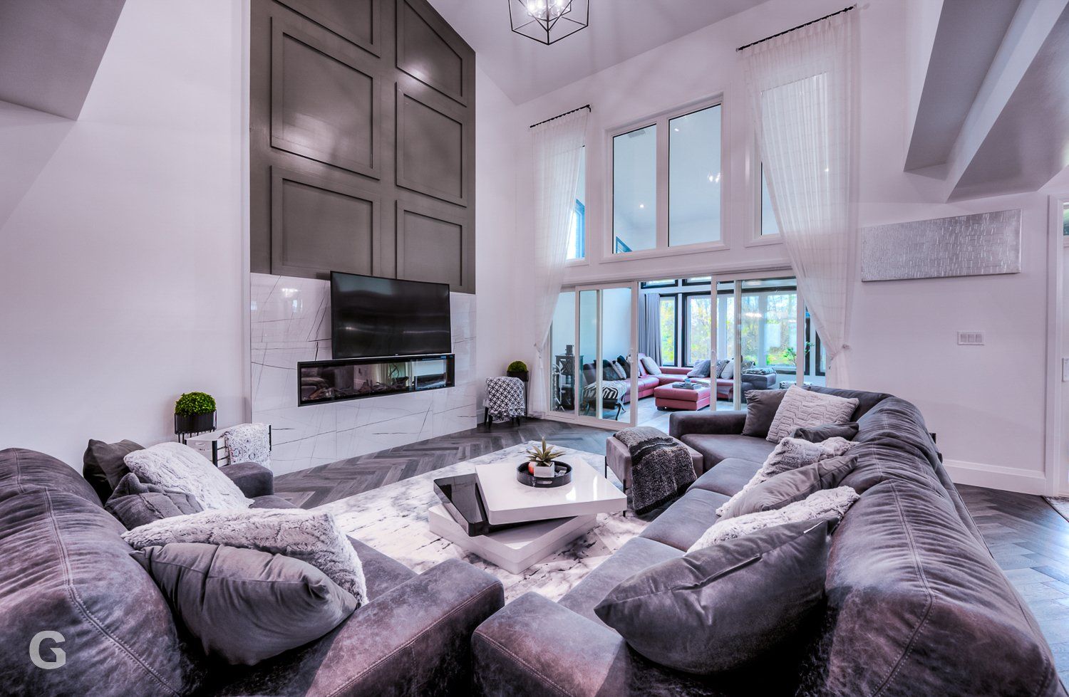 A living room filled with furniture and a flat screen tv.