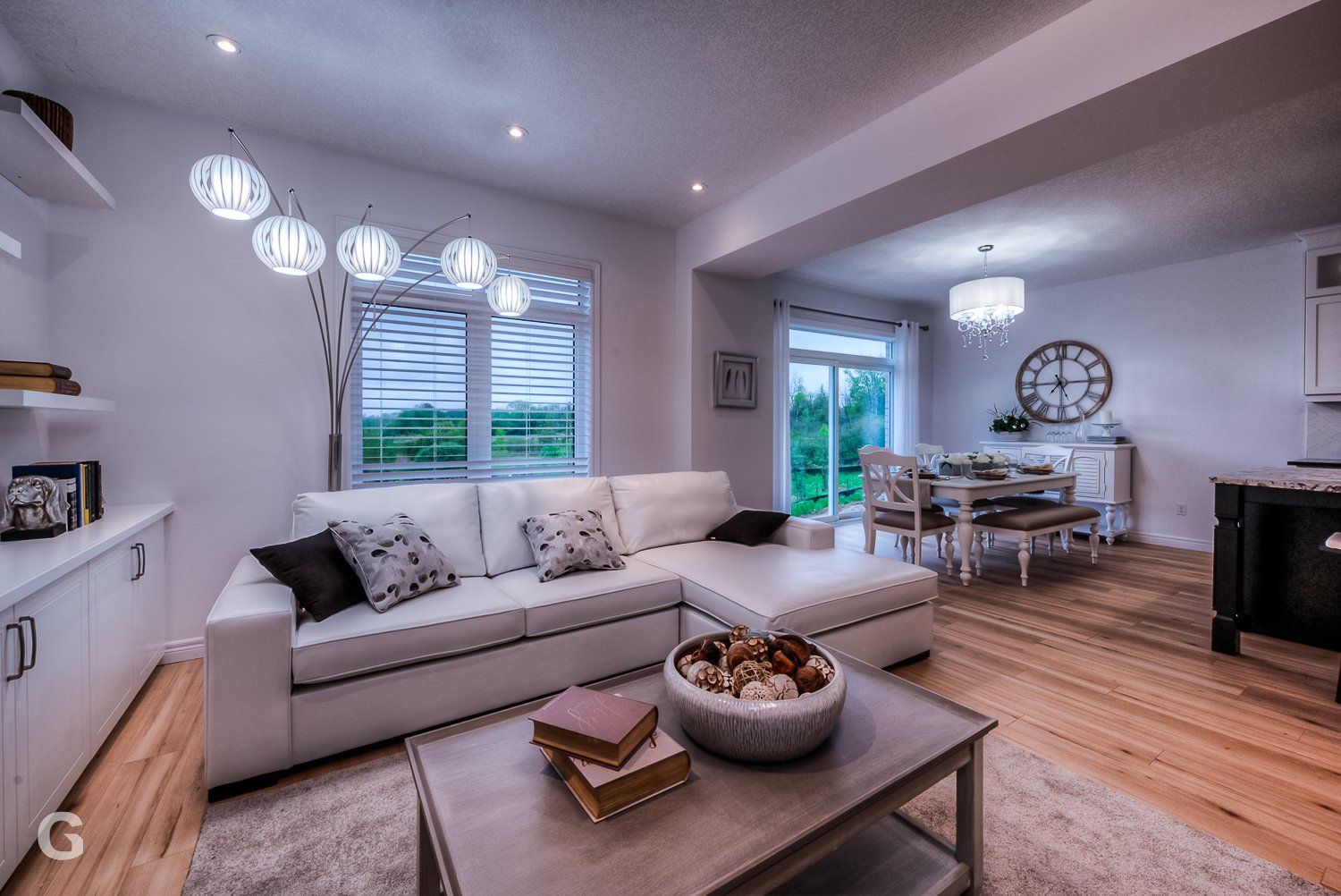 A living room with a white couch and a coffee table