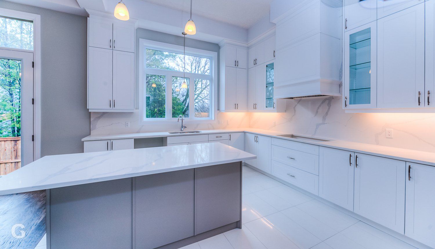 There is a large island in the middle of the kitchen.