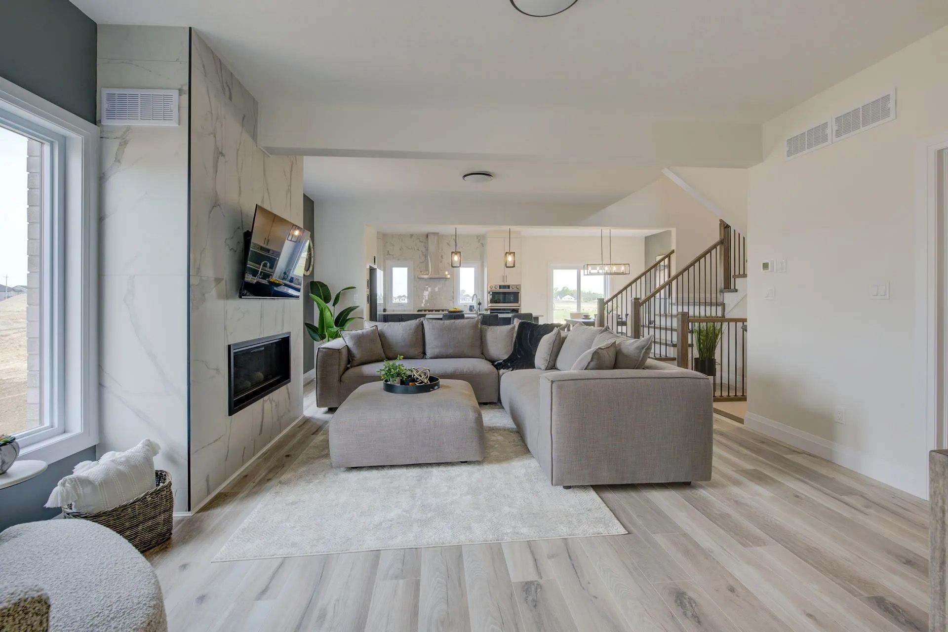 A living room filled with furniture and a fireplace.