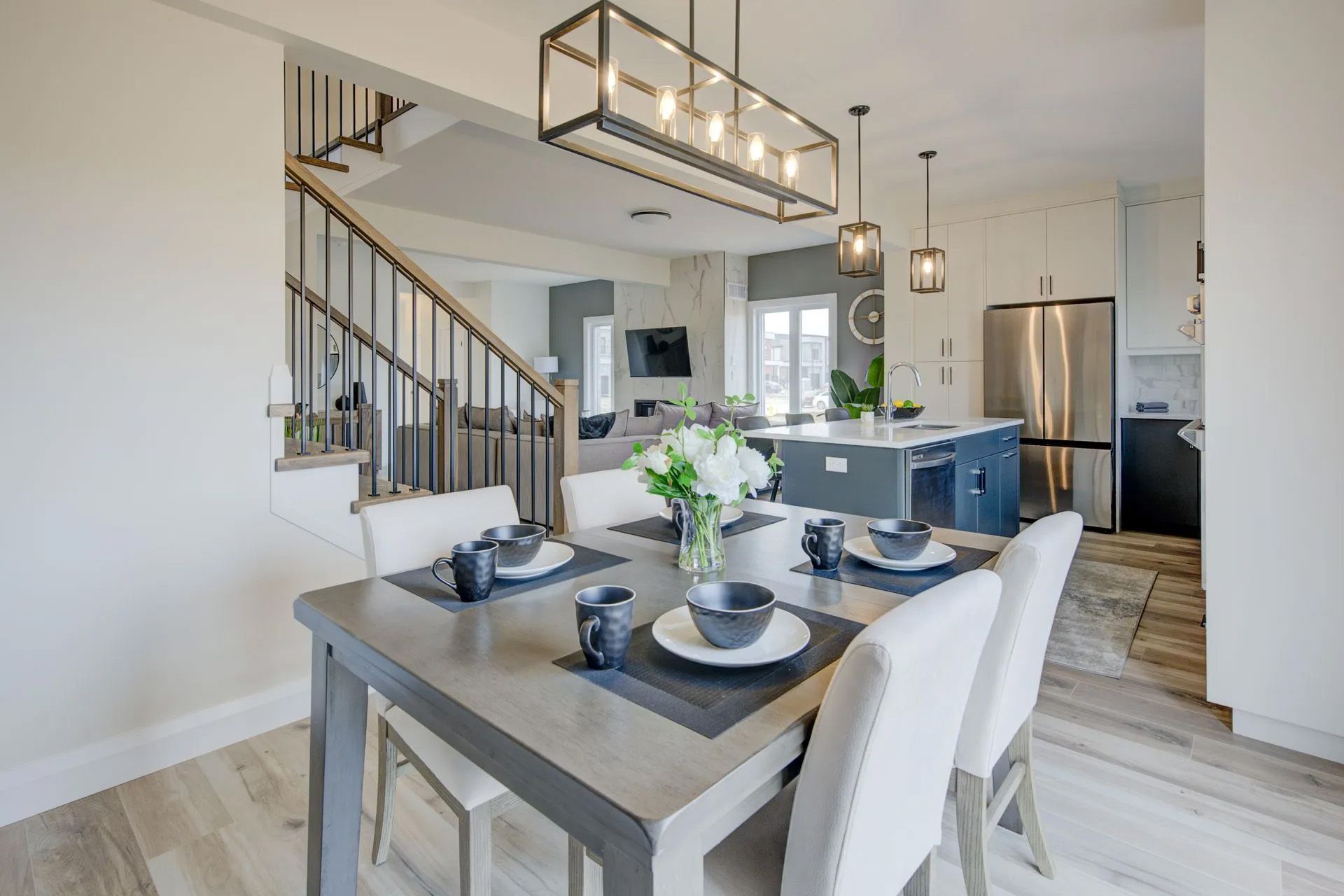 A dining room table with plates and bowls on it in a house.