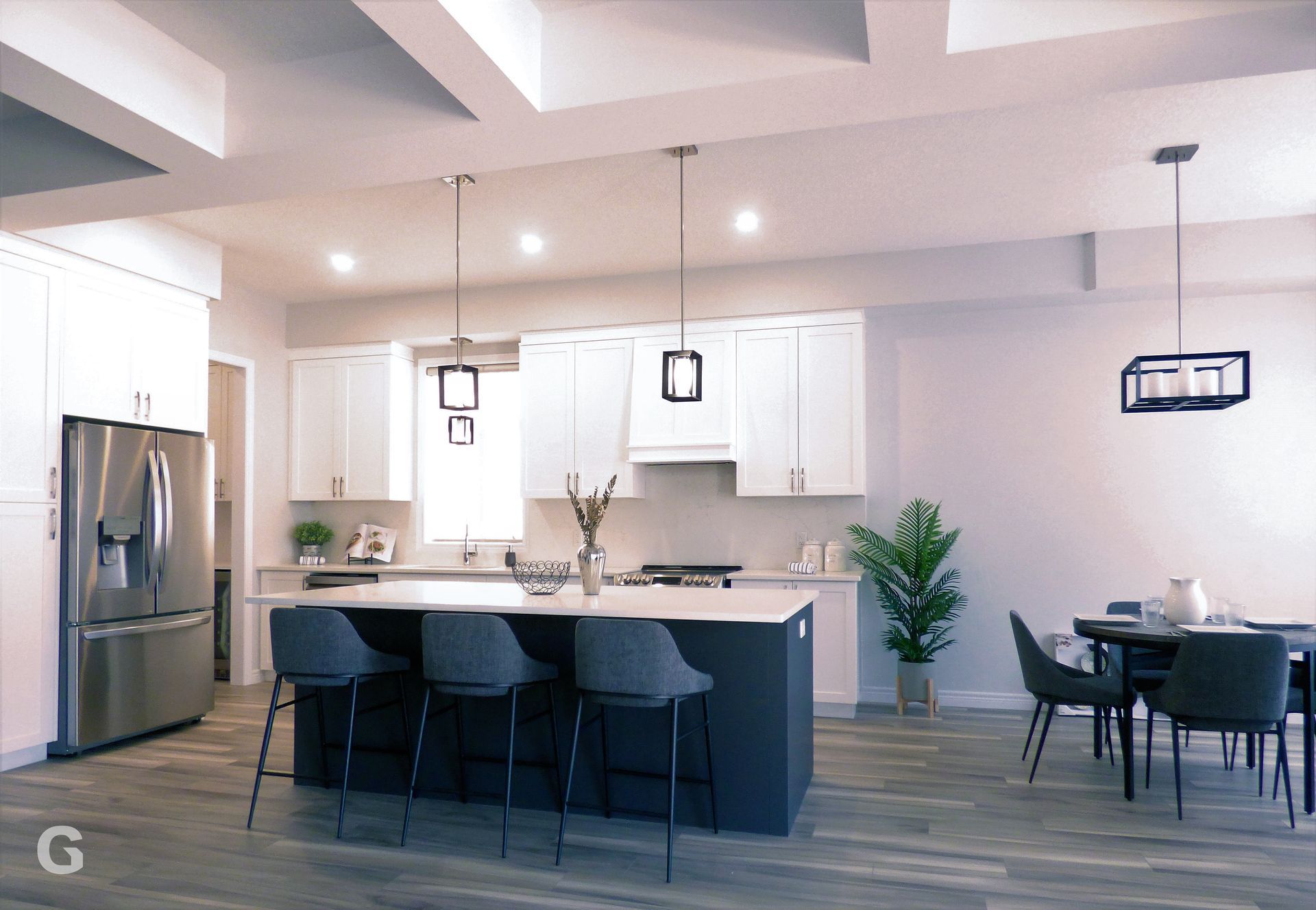 An artist 's impression of a kitchen and dining room in a house.