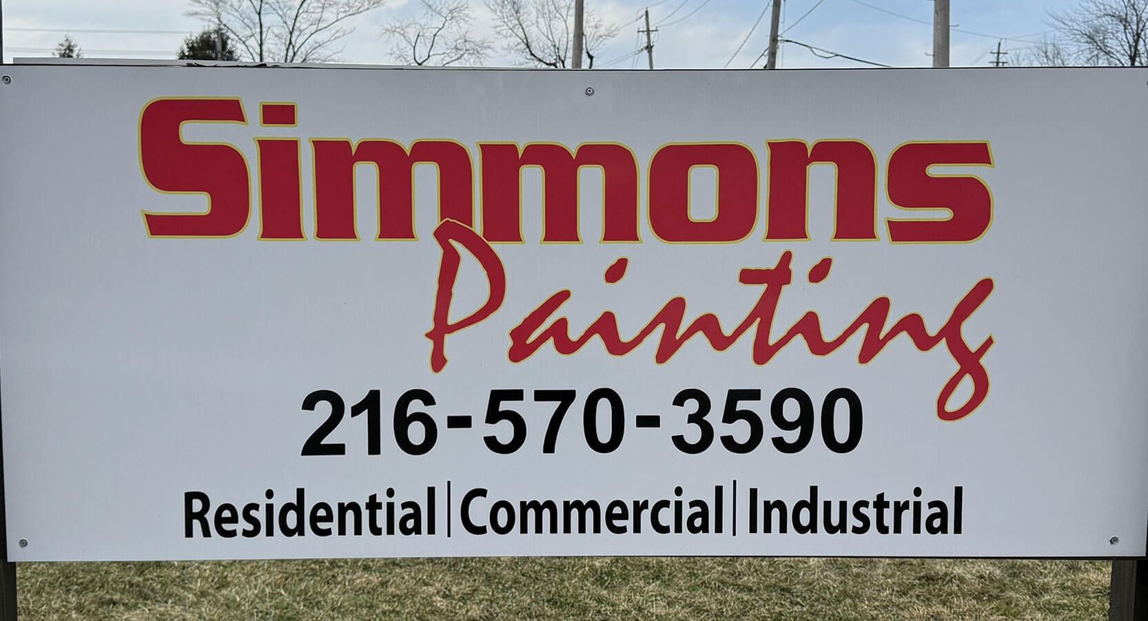 Sign for Simmons Painting: red lettering, phone number, and service types (residential, commercial, industrial).
