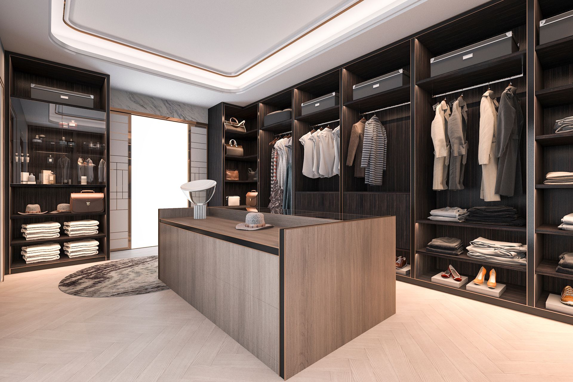 Walk-in closet with dark shelves, clothes, and a central island. Beige and brown tones; well-lit space.