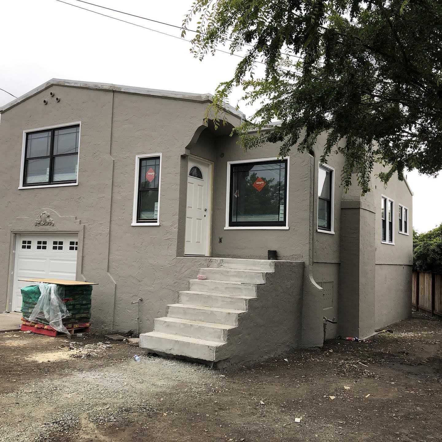 A house with stairs leading up to the front door