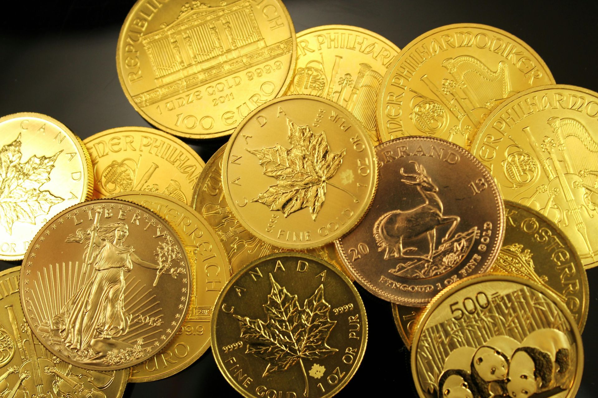 A pile of gold coins with one that says 500 on it