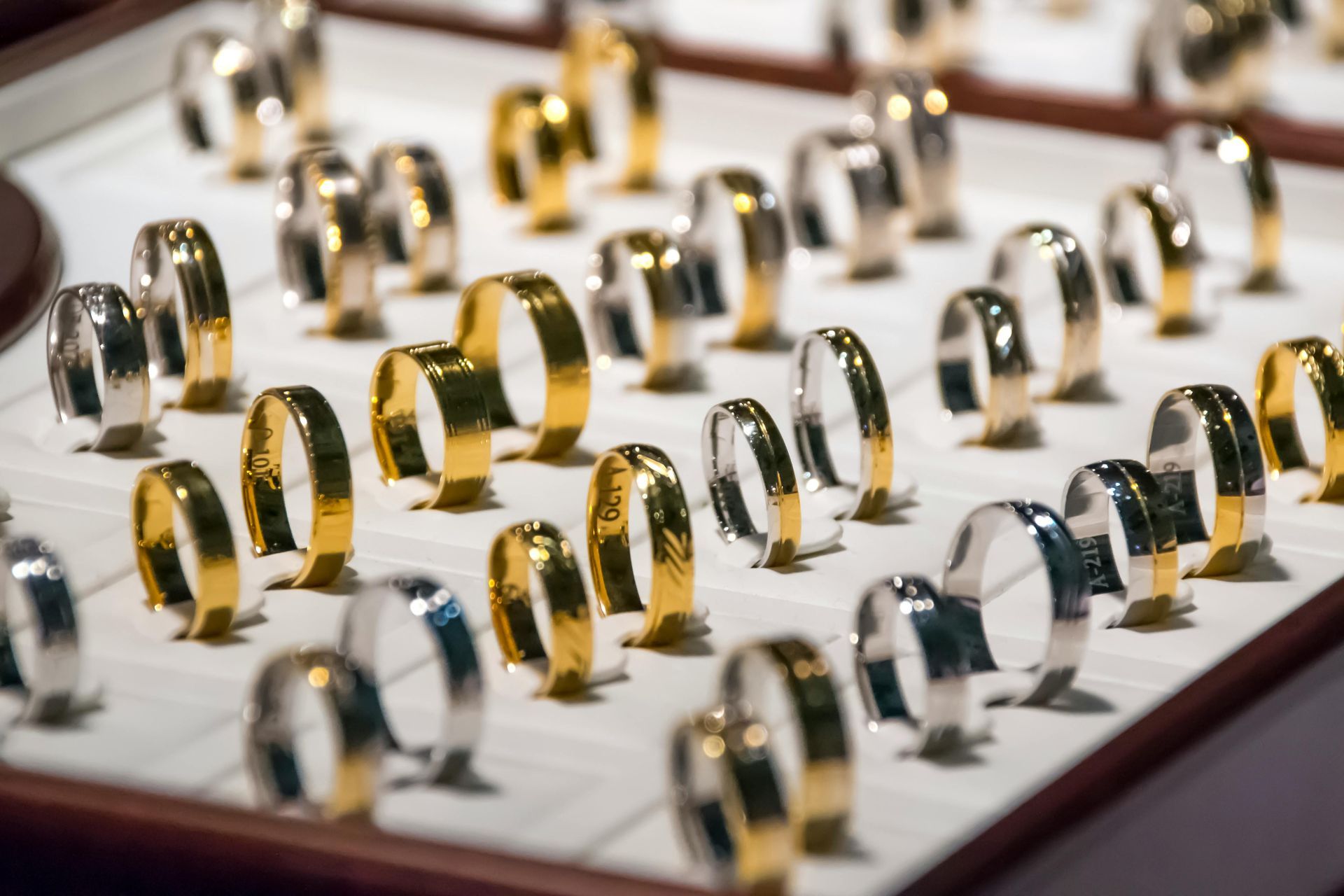 There are many different types of wedding rings on display.