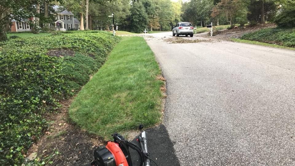 A motorcycle is parked on the side of a road.