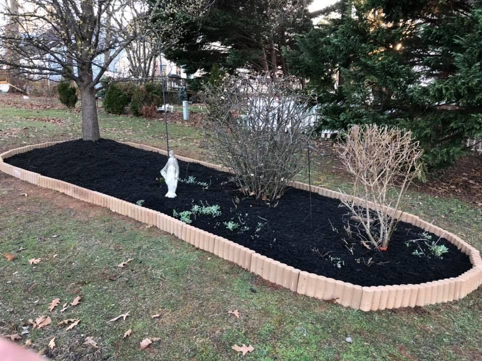 There is a statue in the middle of the garden.